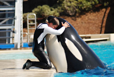 trainer with animal - hug